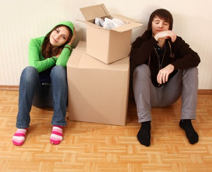Packed office boxes and furniture ready for business relocation