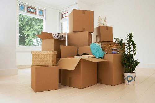 Packed boxes and furniture ready for a man with van removal job