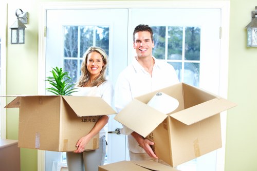 Packed boxes and furniture prepared for removal in an inner-city home